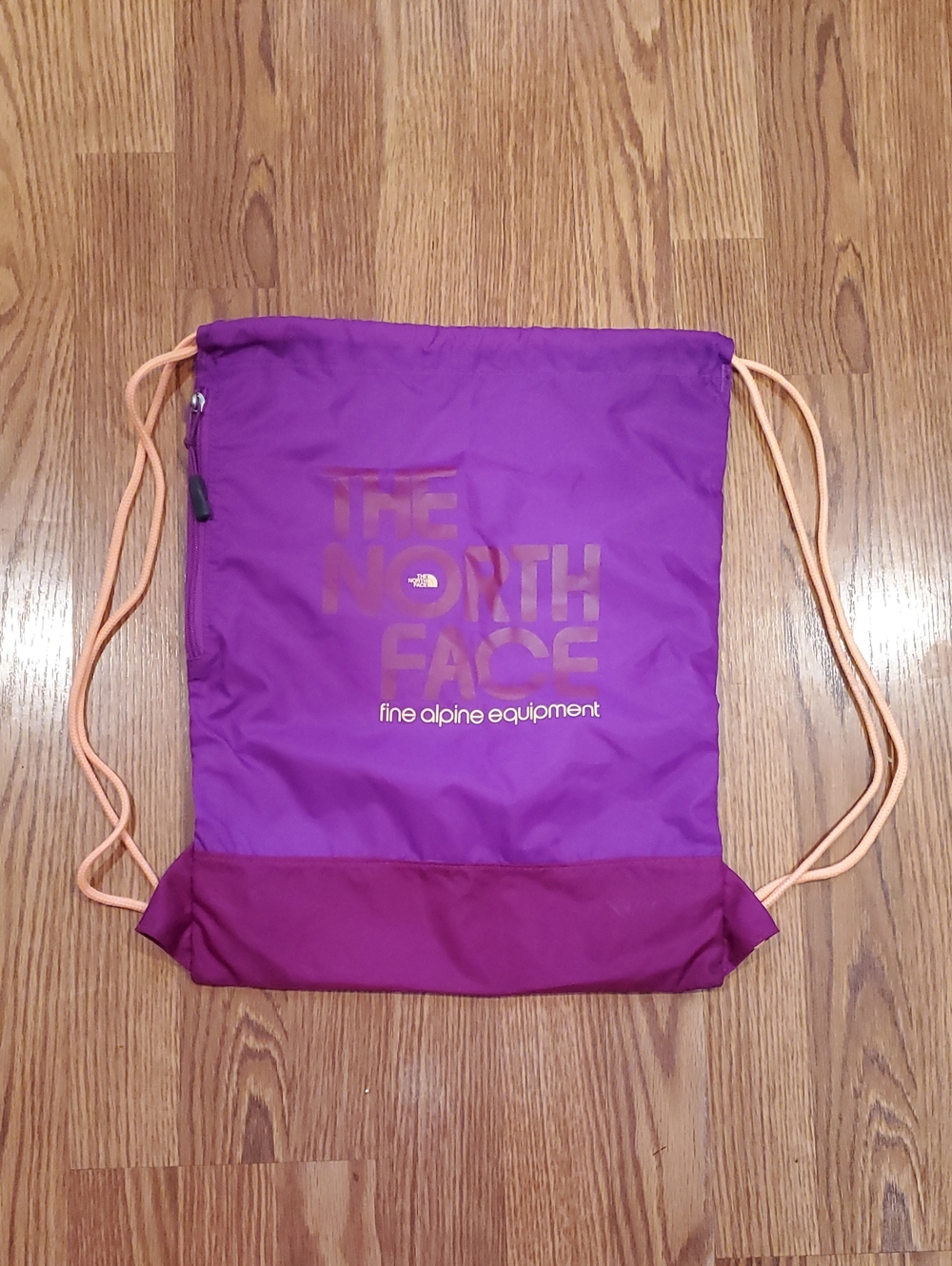 The North Face Purple Drawstring Backpack with Peach Cords With Zippered Pocket